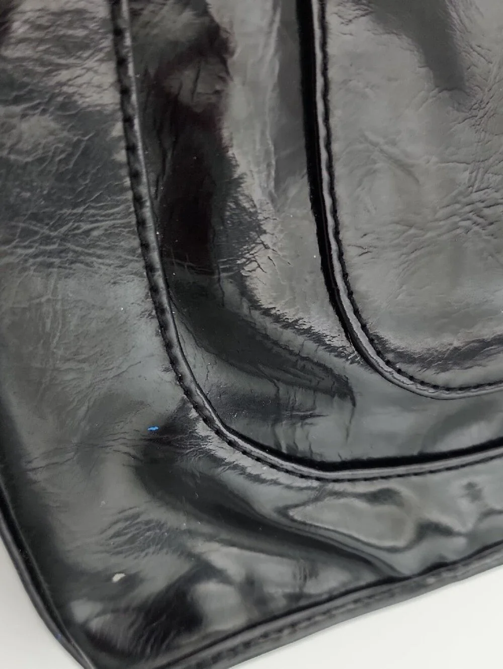 Kenneth Cole Reaction sleek patent